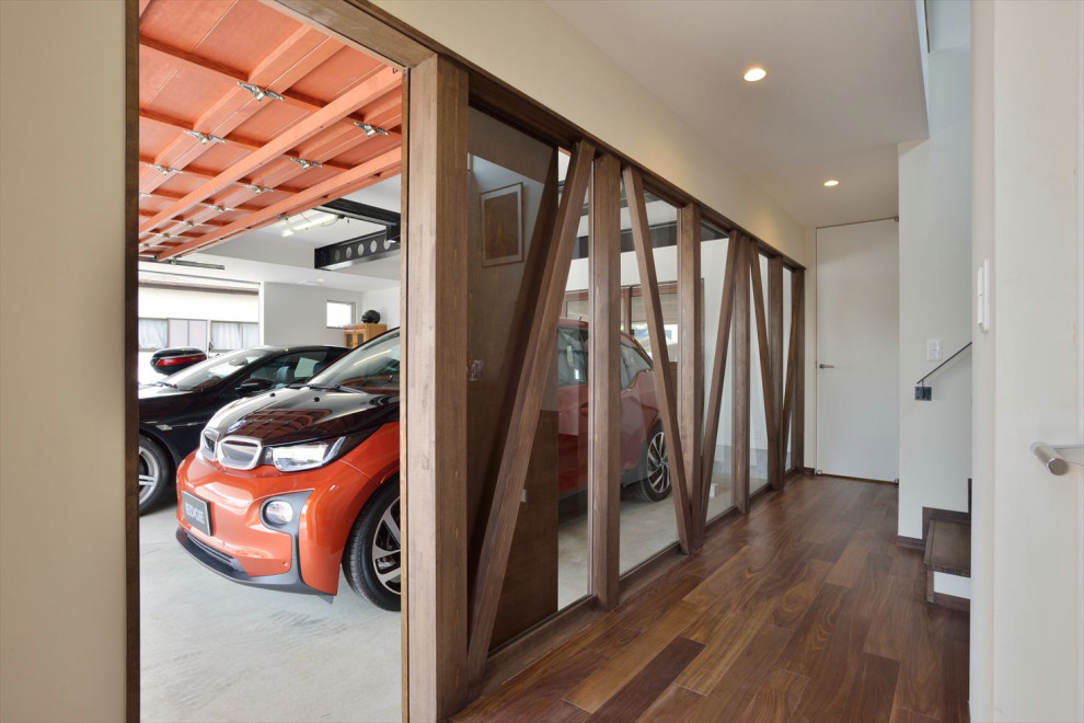 Пример оригинального дизайна: большой отдельно стоящий гараж в стиле модернизм для двух машин