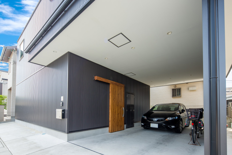 Idées déco pour un garage pour deux voitures attenant moderne de taille moyenne.