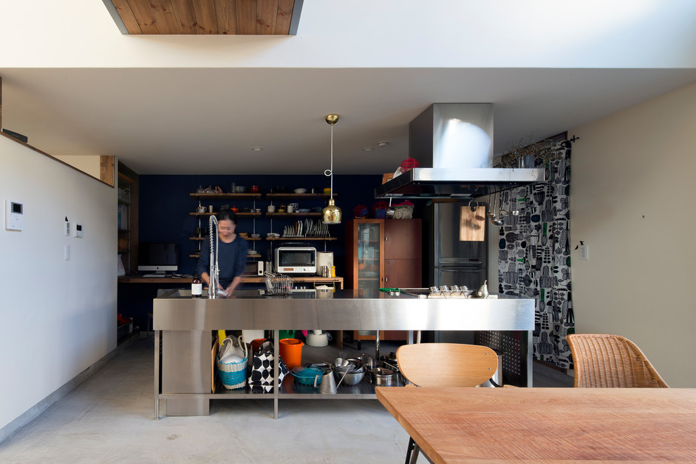 Inspiration for an industrial concrete floor and green floor kitchen remodel in Sapporo with a single-bowl sink, open cabinets, stainless steel countertops and an island