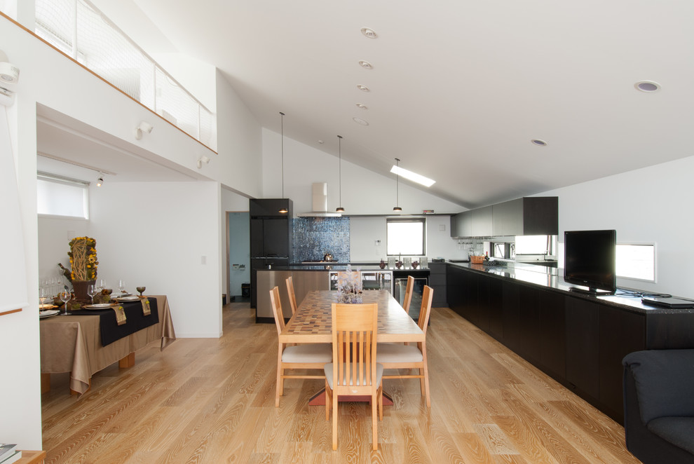 Inspiration for a transitional light wood floor kitchen remodel in Tokyo