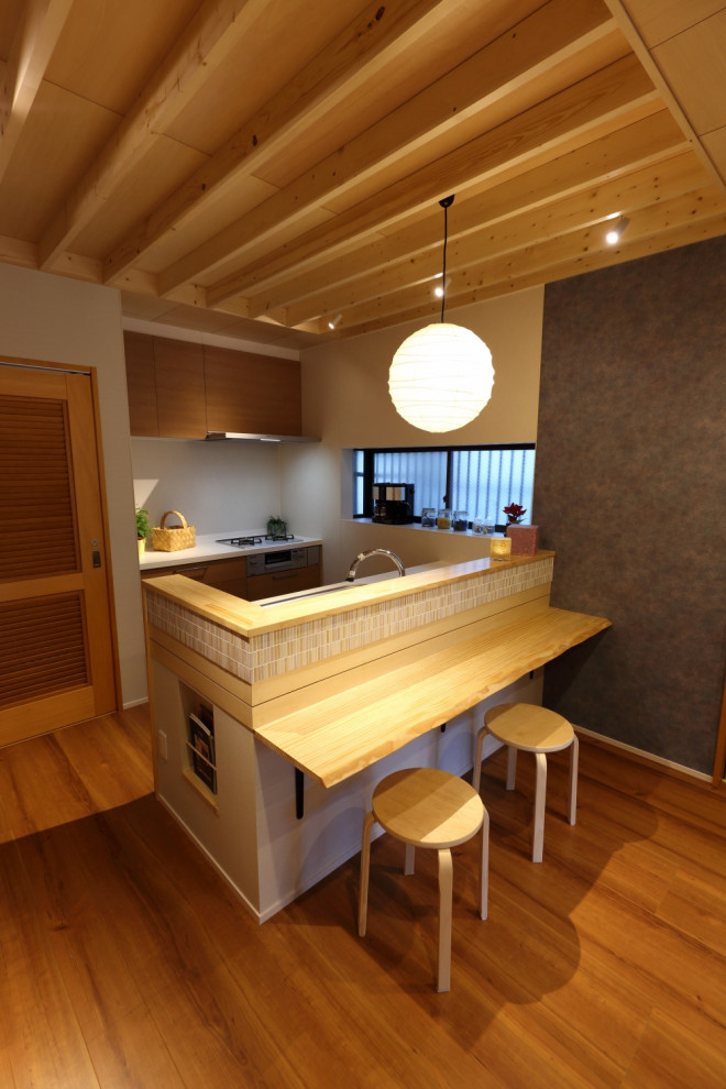 Design ideas for a traditional galley kitchen/diner in Other with a submerged sink, flat-panel cabinets, brown cabinets, composite countertops, plywood flooring, brown floors, white worktops and a wood ceiling.