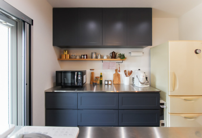 Mid-sized 1960s single-wall open concept kitchen photo in Other with open cabinets, gray cabinets, stainless steel countertops and a peninsula