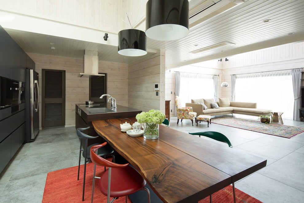 Contemporary single-wall open plan kitchen in Tokyo with a submerged sink, beaded cabinets, dark wood cabinets, stainless steel worktops, stainless steel appliances, an island and grey floors.