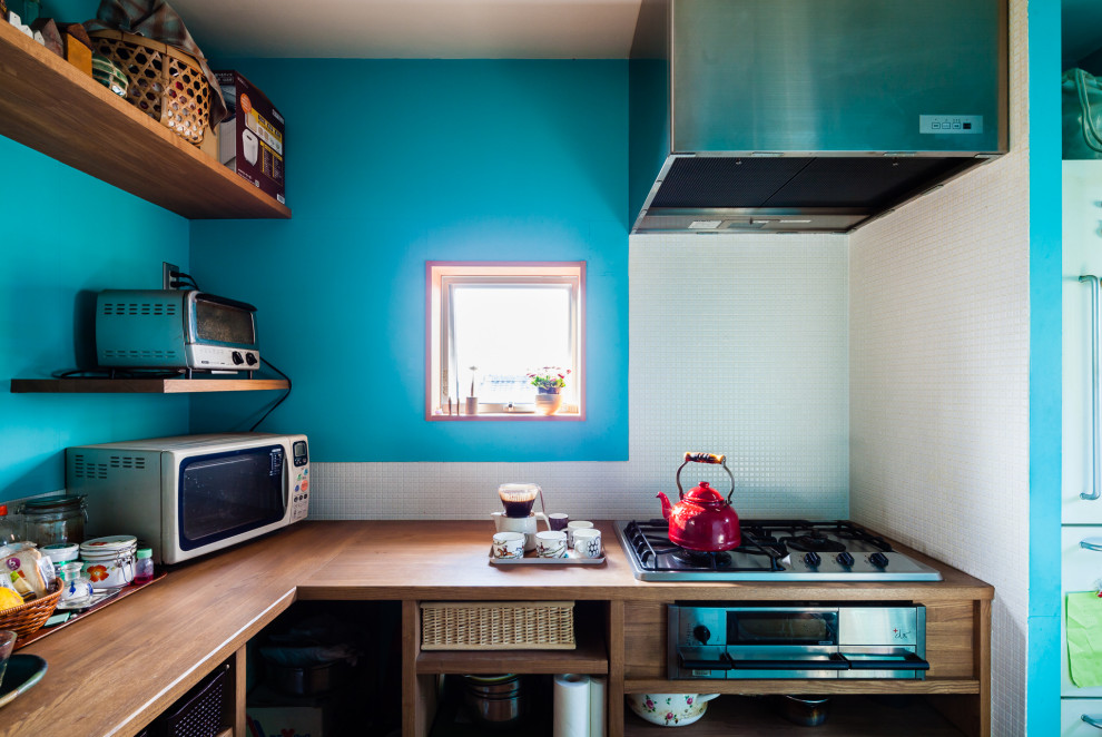 Photo of a small scandi l-shaped enclosed kitchen in Other with a built-in sink, open cabinets, dark wood cabinets, wood worktops, blue splashback, porcelain splashback, stainless steel appliances, dark hardwood flooring, brown floors, brown worktops and a timber clad ceiling.