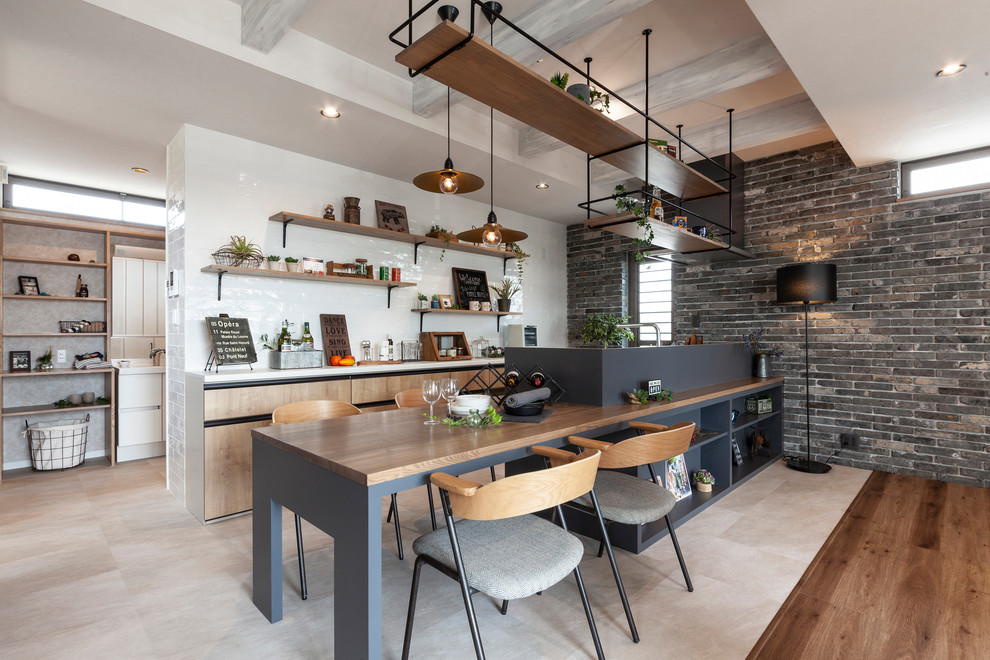 Design ideas for an urban galley kitchen in Other with open cabinets, beige cabinets, white splashback, a breakfast bar, beige floors and white worktops.