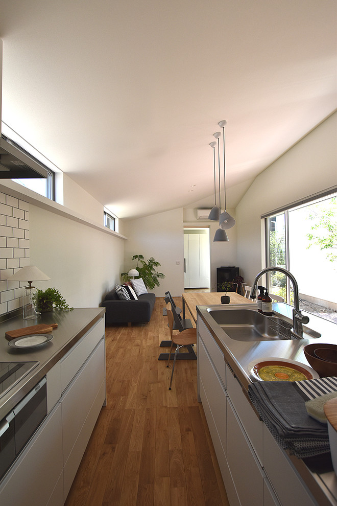 Example of a minimalist kitchen design in Other