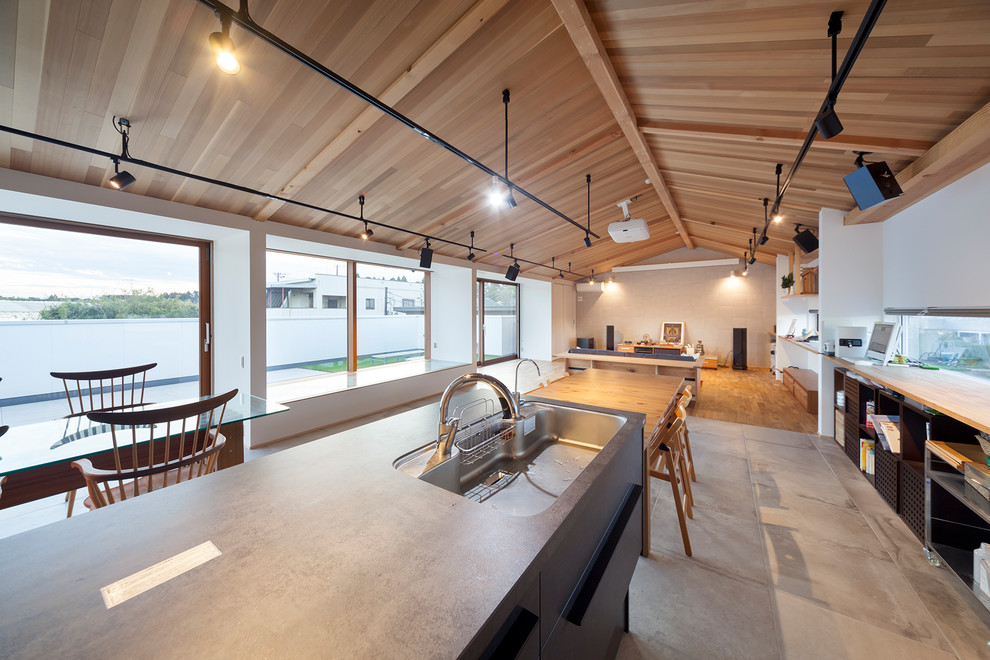 Kitchen in Other with white floors and grey worktops.