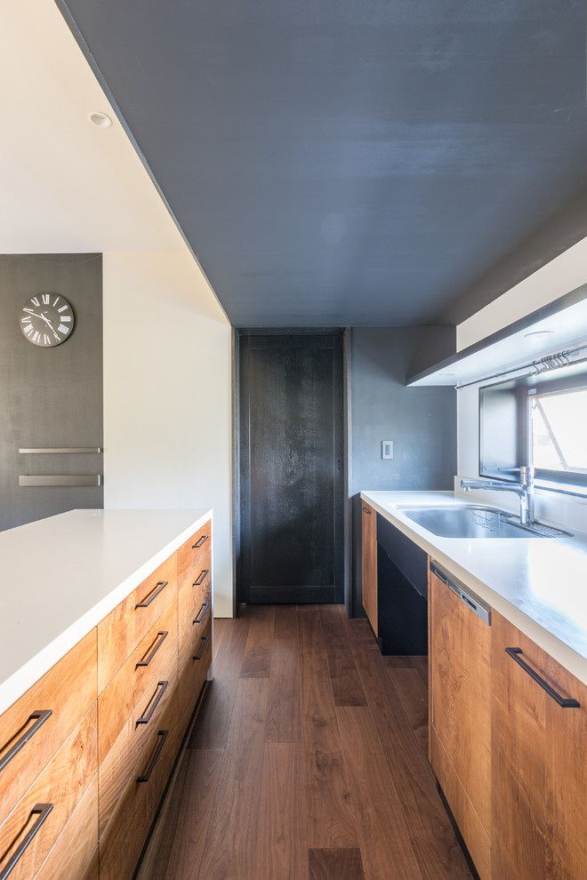This is an example of a world-inspired kitchen in Other with a submerged sink, composite countertops, white splashback, plywood flooring and white worktops.
