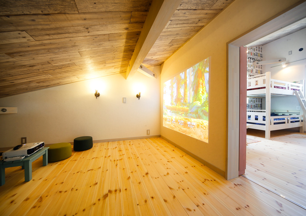 This is an example of a nautical home cinema in Other with white walls, light hardwood flooring and a projector screen.
