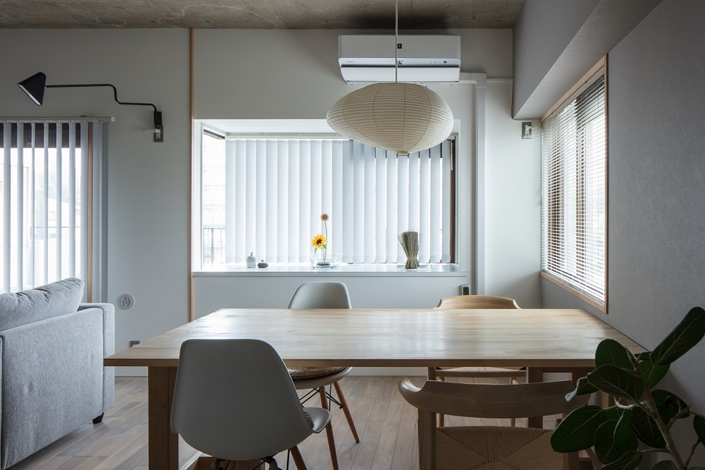 Example of an urban dining room design in Other