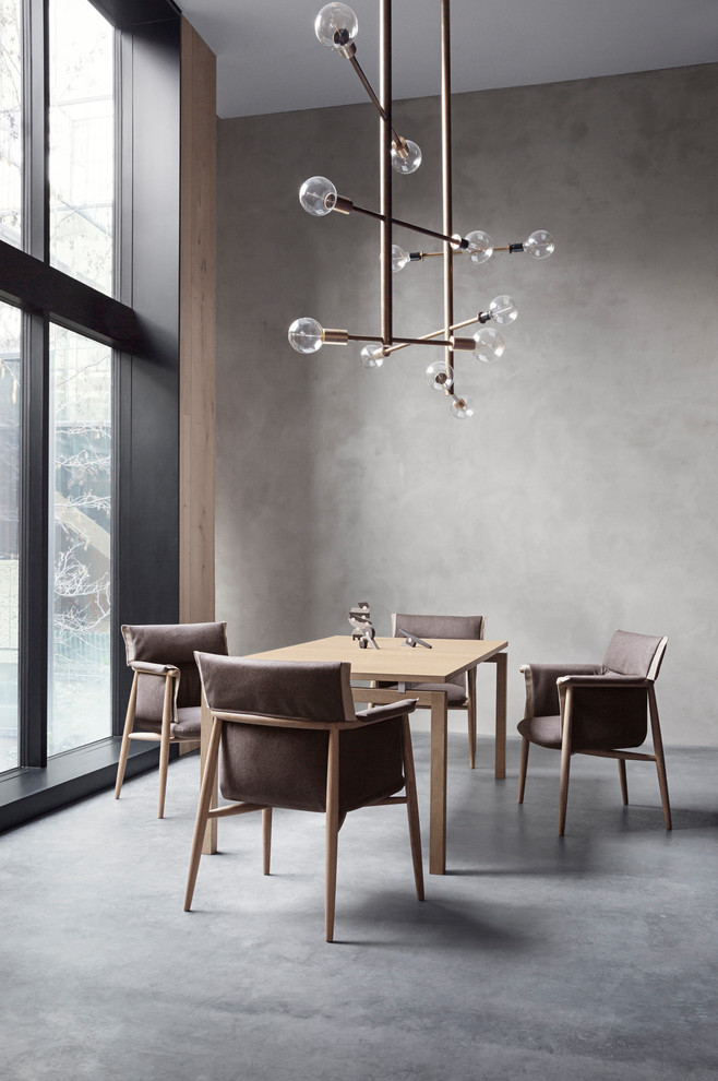 Свежая идея для дизайна: столовая в скандинавском стиле с серыми стенами, серым полом и бетонным полом - отличное фото интерьера
