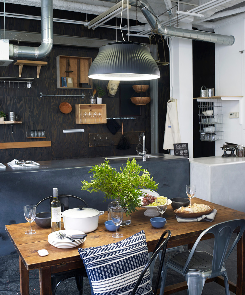 Photo of a small industrial dining room in Other.