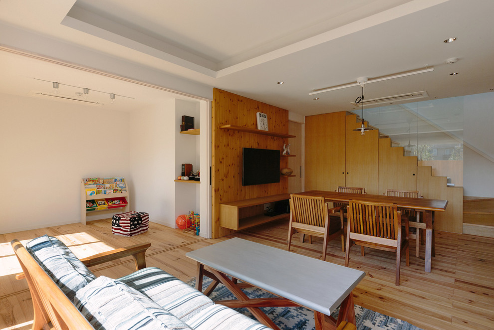 Mid-sized minimalist light wood floor and beige floor great room photo in Tokyo Suburbs with white walls