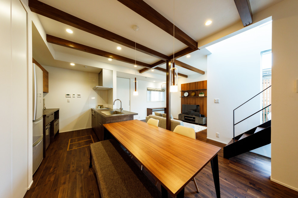 Example of a mid-sized zen dark wood floor and brown floor great room design in Tokyo Suburbs with white walls