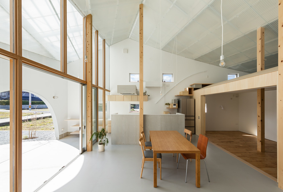 Dining room - contemporary gray floor dining room idea in Kobe