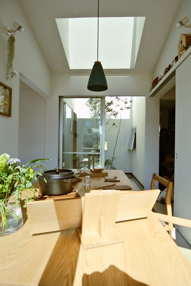 Photo of a scandi kitchen/dining room in Yokohama with white walls.