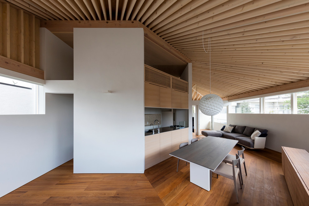 Contemporary open plan dining room in Tokyo Suburbs with white walls and medium hardwood flooring.