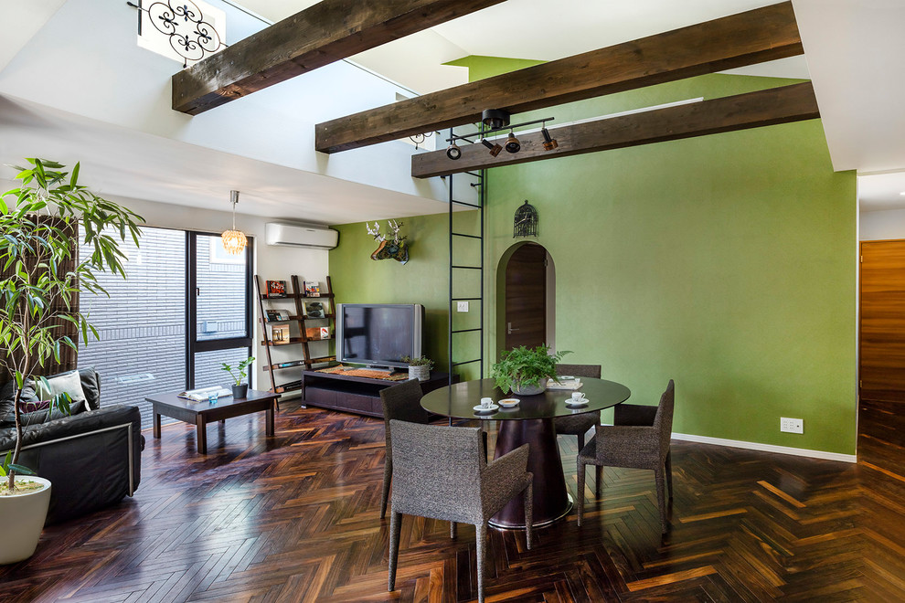 Photo of a mediterranean open plan dining room in Tokyo Suburbs with green walls and dark hardwood flooring.