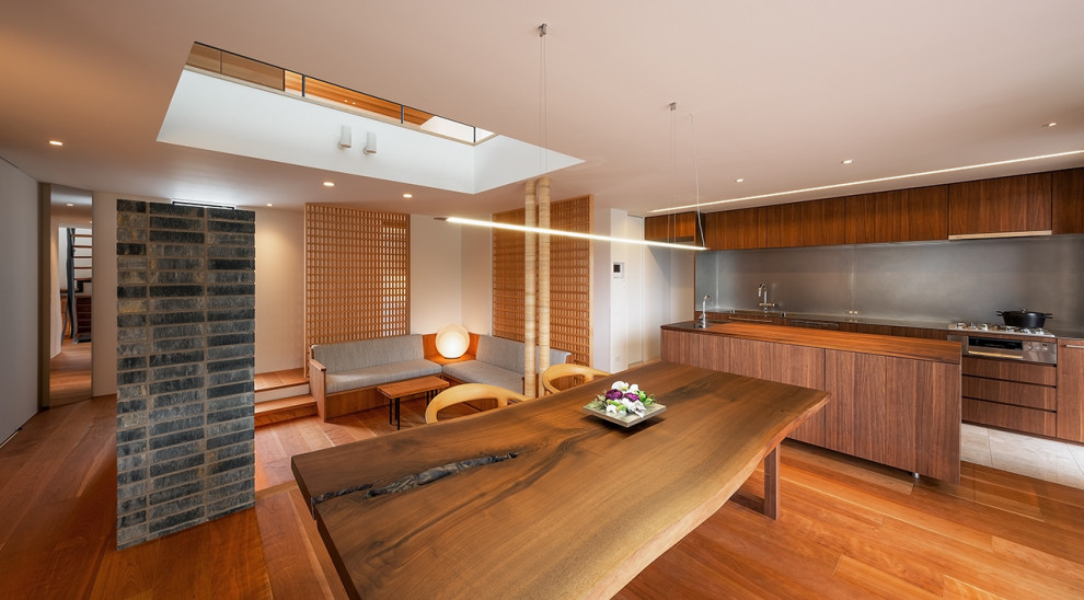 Photo of a dining room in Osaka with white walls, painted wood flooring and a timber clad ceiling.