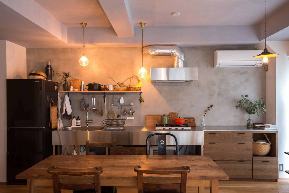 Inspiration for an industrial light wood floor, shiplap ceiling and shiplap wall great room remodel in Tokyo