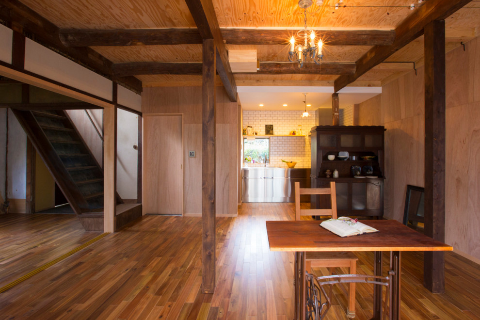 Design ideas for a medium sized world-inspired open plan dining room in Kyoto with medium hardwood flooring.