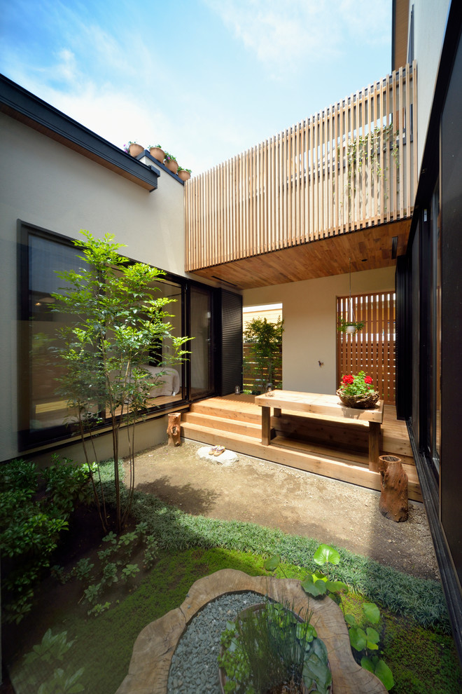 This is an example of a world-inspired courtyard patio in Other with no cover.