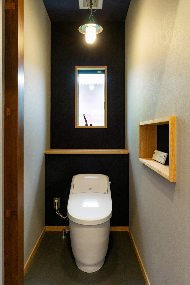 Example of a mountain style powder room design in Other