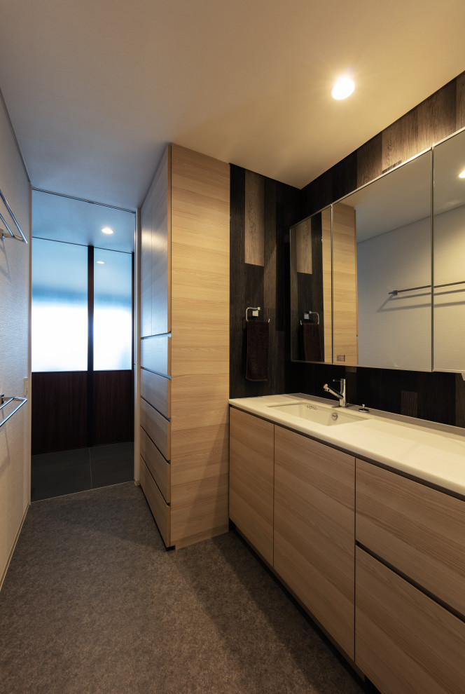 Inspiration for a contemporary cloakroom in Other with beaded cabinets, light wood cabinets, black tiles, porcelain tiles, vinyl flooring, a submerged sink, wooden worktops, grey floors, white worktops and a built in vanity unit.