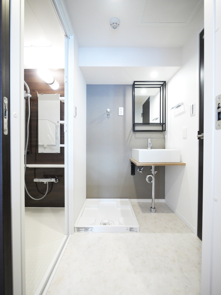 Modern cloakroom in Tokyo with grey walls, ceramic flooring, white floors, beige worktops, a floating vanity unit, a wallpapered ceiling and wallpapered walls.