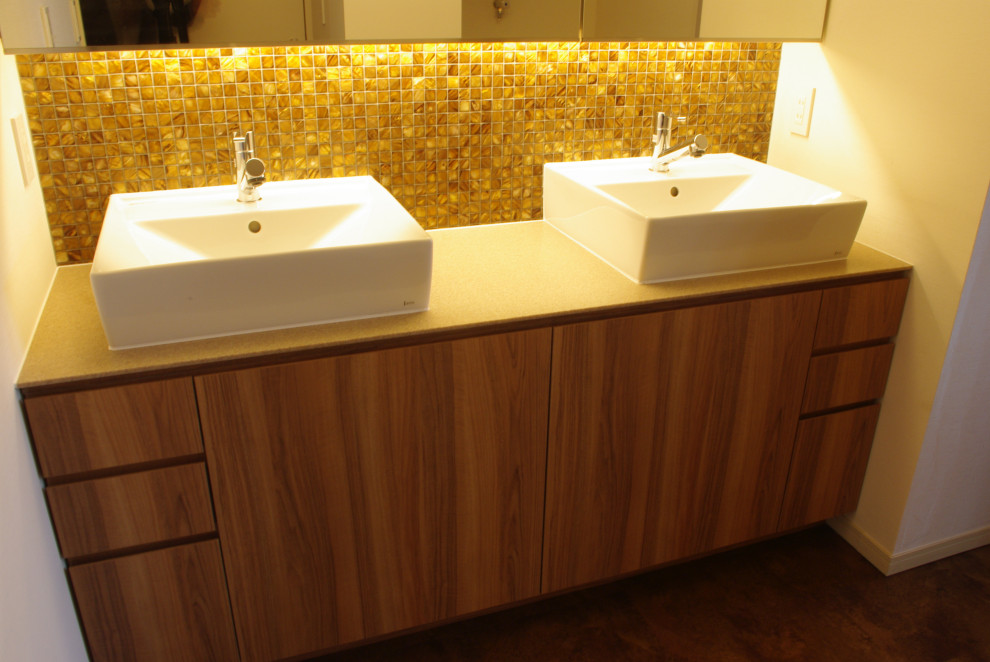 This is an example of a modern cloakroom in Tokyo Suburbs with flat-panel cabinets, brown cabinets, black and white tiles, marble tiles, white walls, dark hardwood flooring, a vessel sink, engineered stone worktops, brown floors, beige worktops, a built in vanity unit and a wallpapered ceiling.