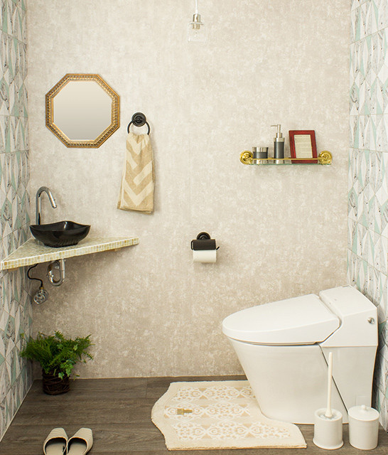 Photo of a small modern cloakroom in Other with a one-piece toilet, beige walls, a built-in sink, tiled worktops, brown floors and multi-coloured worktops.