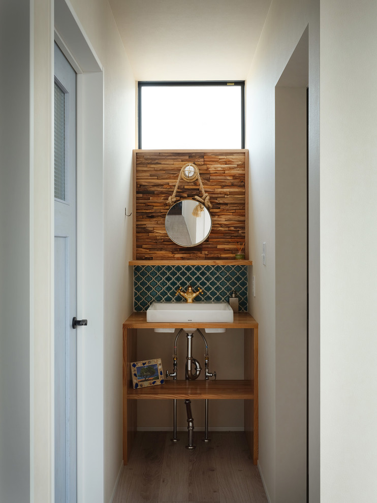 Nautical cloakroom in Other with blue tiles, mosaic tiles, wooden worktops and white worktops.