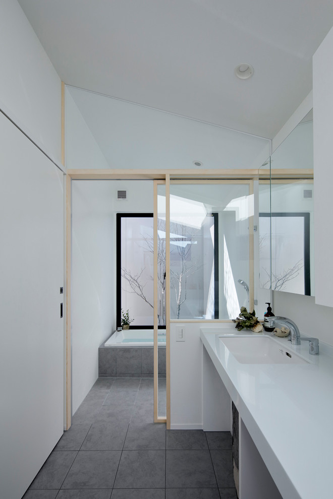 Inspiration for a modern powder room remodel in Other