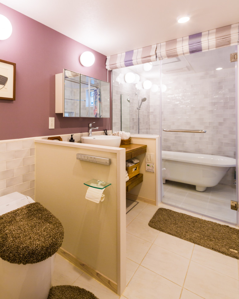 Example of a mid-sized danish gray tile and porcelain tile porcelain tile and white floor bathroom design in Other with open cabinets, a one-piece toilet, purple walls, a vessel sink, wood countertops and brown countertops