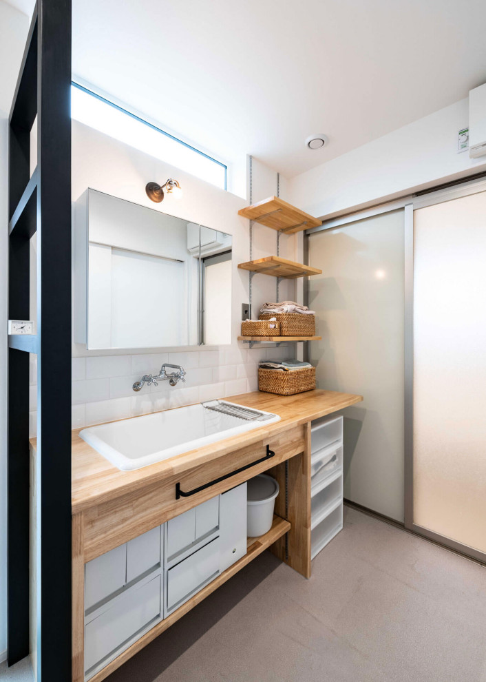 Photo of a contemporary cloakroom in Fukuoka with white cabinets, white tiles and beige worktops.