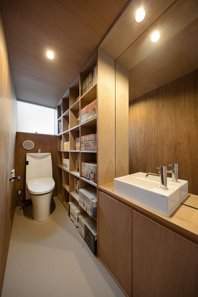 Inspiration for a contemporary gray floor powder room remodel in Tokyo with flat-panel cabinets, medium tone wood cabinets, brown walls, a vessel sink, wood countertops and brown countertops