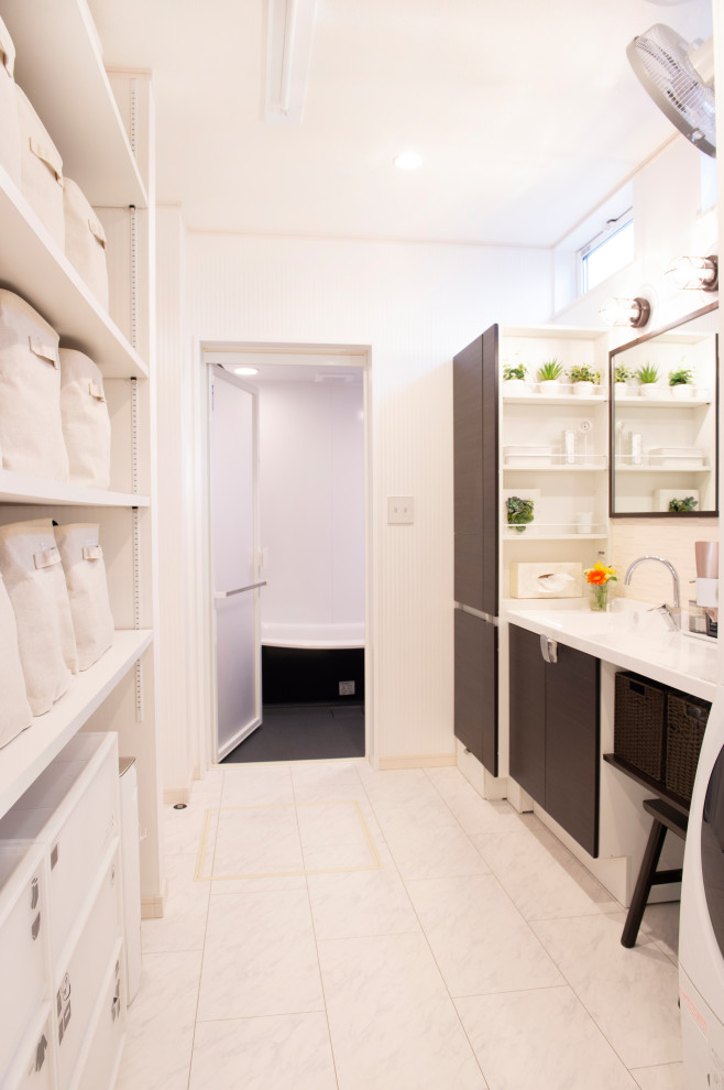 Small modern cloakroom in Other with freestanding cabinets, dark wood cabinets, white tiles, ceramic tiles, plywood flooring, an integrated sink, solid surface worktops, white floors, white worktops, a built in vanity unit, a wallpapered ceiling and wallpapered walls.