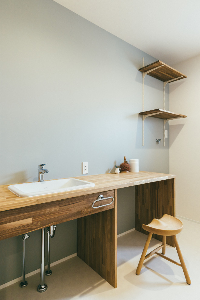 Inspiration for a medium sized scandinavian cloakroom in Other with open cabinets, dark wood cabinets, grey walls, vinyl flooring, a submerged sink, beige floors and white worktops.