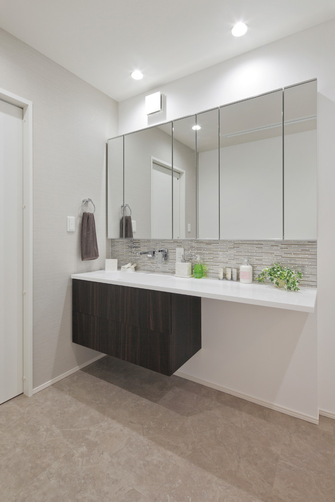 Design ideas for a scandi cloakroom in Other with dark wood cabinets, white walls, beige floors and white worktops.