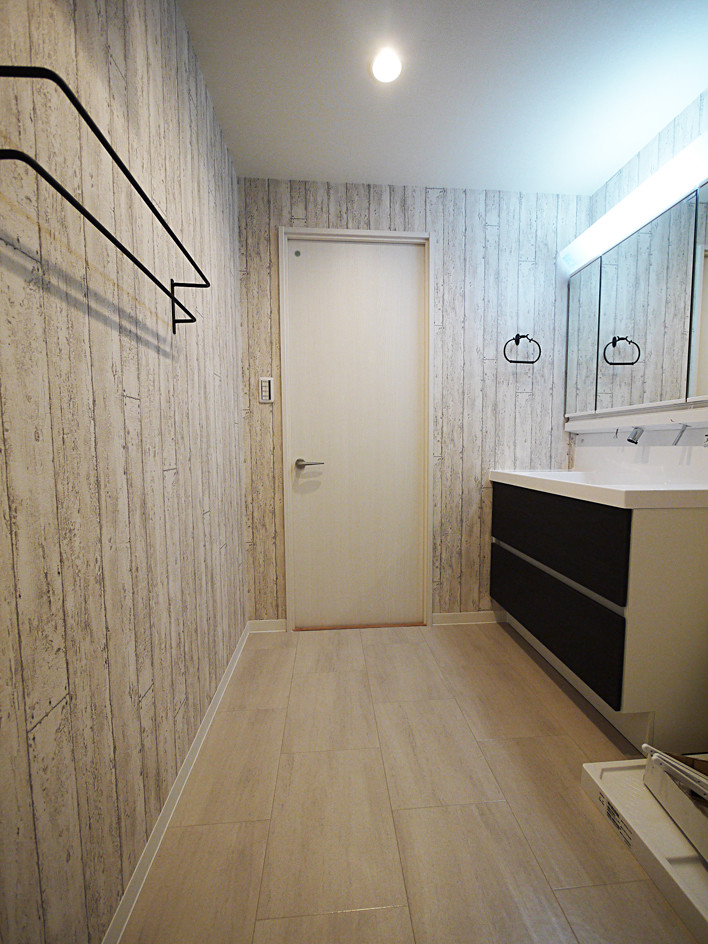 Design ideas for a mediterranean cloakroom in Tokyo with black cabinets, beige walls, ceramic flooring, beige floors and white worktops.