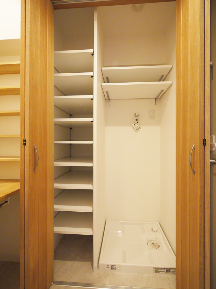 Design ideas for a rural cloakroom in Tokyo with white walls and wooden worktops.