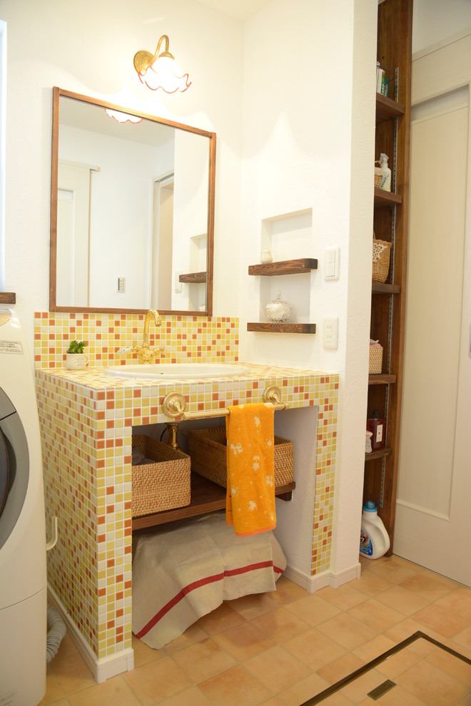 Design ideas for a scandi cloakroom in Other with open cabinets, orange tiles, white tiles, yellow tiles, mosaic tiles, white walls, terracotta flooring, a submerged sink and tiled worktops.