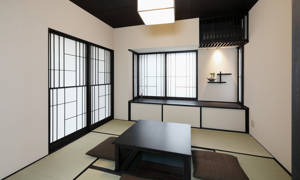 Inspiration for a tatami floor and green floor family room remodel in Tokyo with white walls