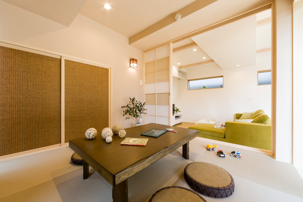Inspiration for a scandinavian enclosed games room in Other with beige walls, tatami flooring and beige floors.