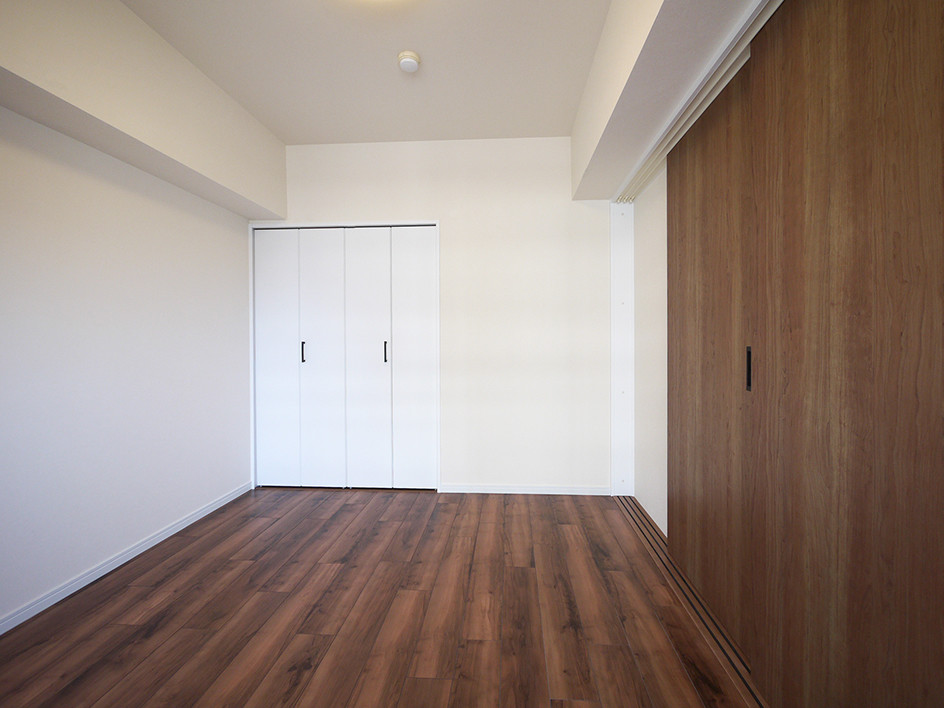 Design ideas for a modern open plan games room in Tokyo with white walls, plywood flooring and brown floors.