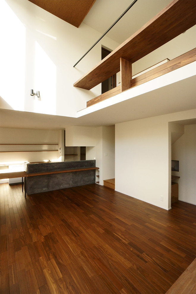 Photo of a world-inspired mezzanine games room in Nagoya with white walls and dark hardwood flooring.