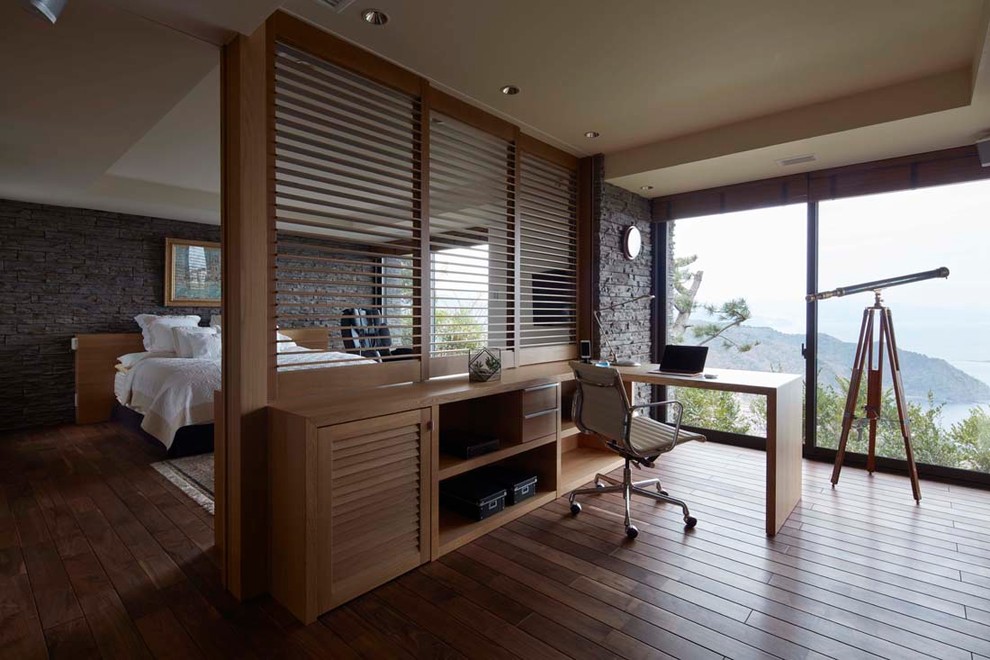Inspiration for a zen built-in desk dark wood floor and brown floor study room remodel in Tokyo Suburbs with gray walls