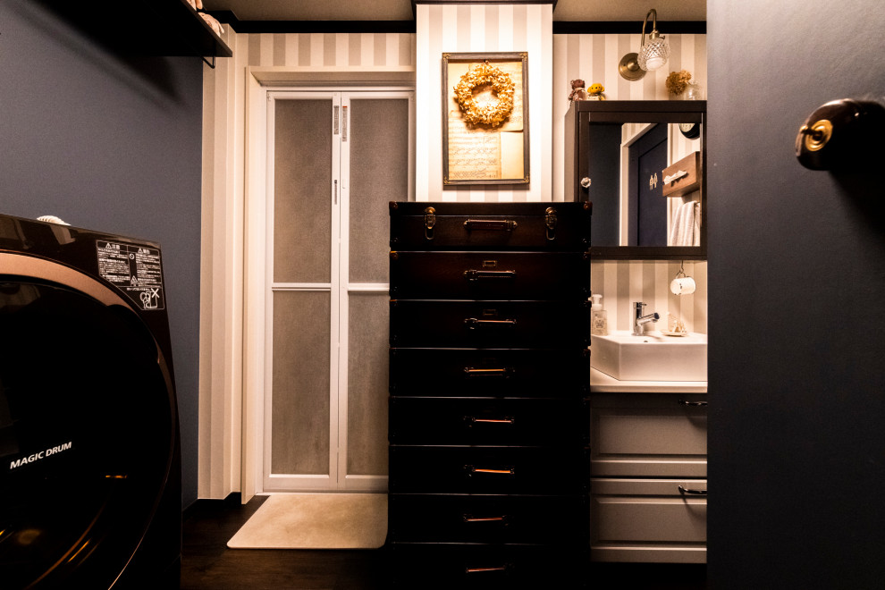 This is an example of a medium sized traditional utility room in Other with grey walls and brown floors.