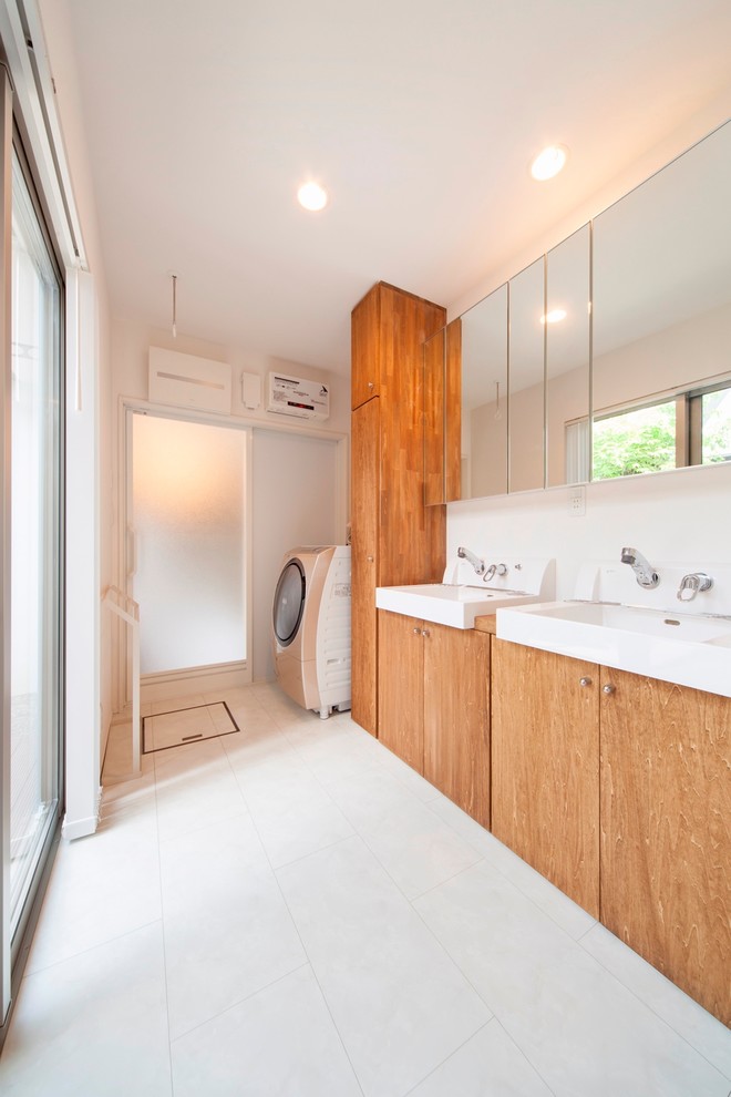 Example of a danish white floor laundry room design in Other with white walls