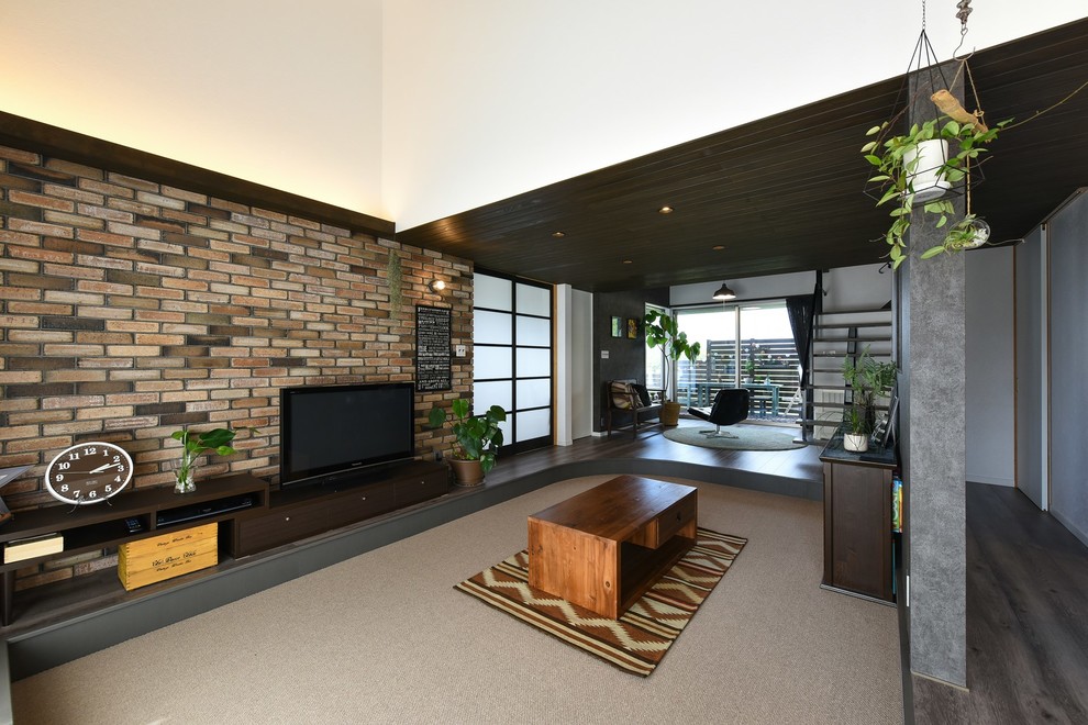 Urban enclosed living room in Other with multi-coloured walls, carpet, a freestanding tv and grey floors.